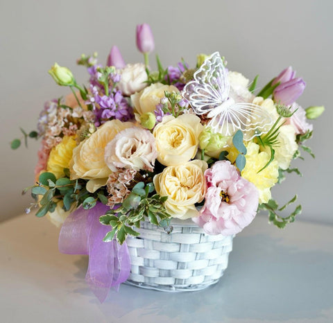 Adorable basket of delicate flowers